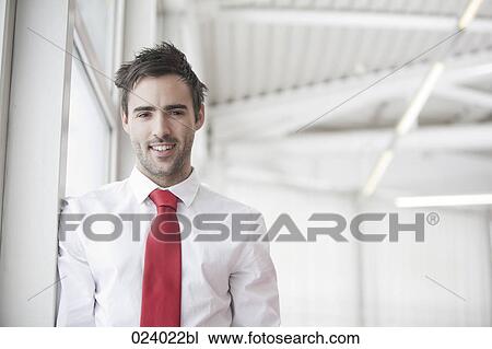 Stock Image - portrait of young businessman. Fotosearch