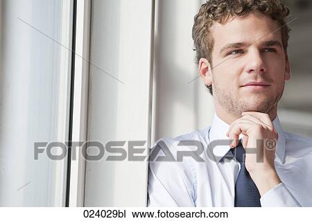 Stock Image - portrait of young businessman. Fotosearch
