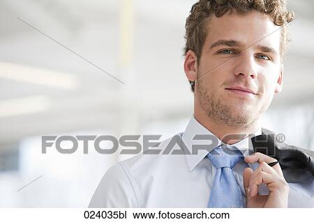 Stock Image - portrait of young businessman. Fotosearch