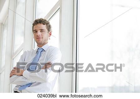 Stock Image - portrait of young businessman. Fotosearch