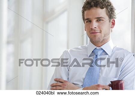 Stock Image - portrait of young businessman. Fotosearch