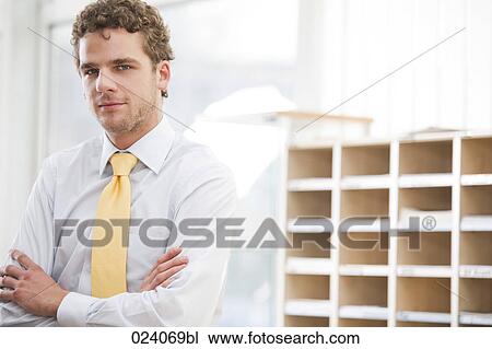 Stock Image - portrait of young businessman. Fotosearch