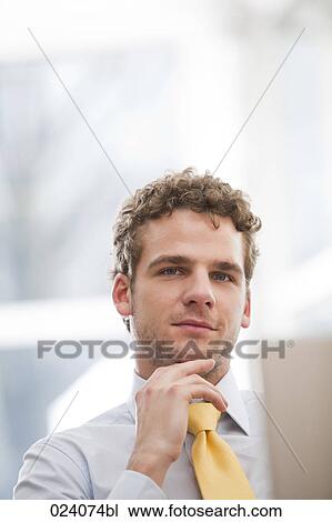 Stock Image - portrait of young businessman. Fotosearch