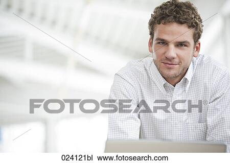 Stock Image - portrait of young businessman. Fotosearch