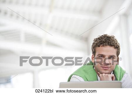 Stock Image - portrait of young businessman. Fotosearch