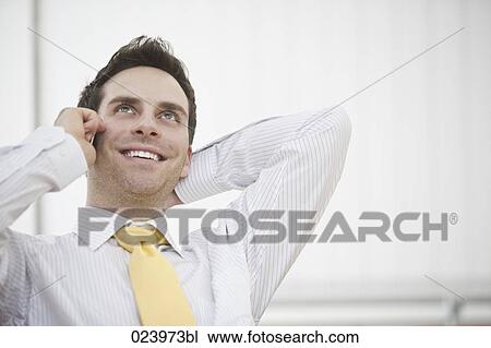portrait of young businessman talking on mobile phone View Large Photo Image Stock Image - portrait of young businessman talking on mobile phone. Fotosearch