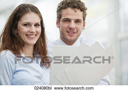 portrait of young businesswoman and male colleague View Large Photo Image Stock Image - portrait of young businesswoman and male colleague. Fotosearch