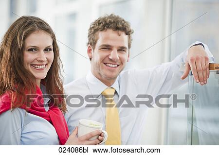 portrait of young businesswoman and male colleague View Large Photo Image Stock Image - portrait of young businesswoman and male colleague. Fotosearch