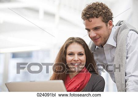 portrait of young businesswoman and male colleague View Large Photo Image Stock Image - portrait of young businesswoman and male colleague. Fotosearch