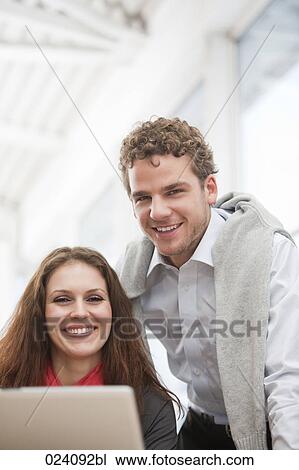 portrait of young businesswoman and male colleague View Large Photo Image Stock Image - portrait of young businesswoman and male colleague. Fotosearch