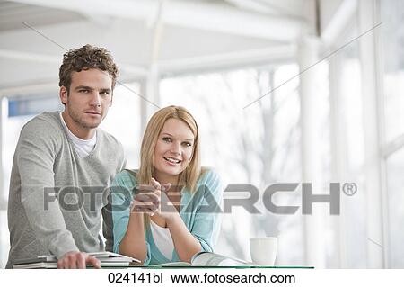 portrait of young businesswoman and male colleague View Large Photo Image Stock Image - portrait of young businesswoman and male colleague. Fotosearch