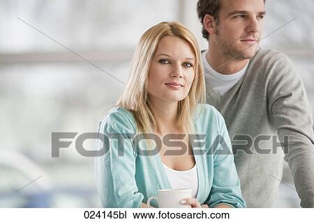 Stock Image - portrait of young businesswoman and male colleague. Fotosearch
