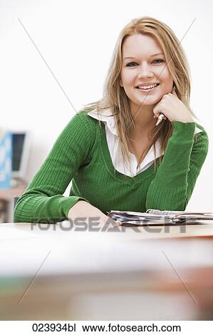 portrait of young businesswoman at desk View Large Photo Image Stock Image - portrait of young businesswoman at desk. Fotosearch