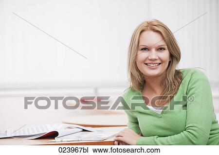portrait of young businesswoman at desk View Large Photo Image Stock Image - portrait of young businesswoman at desk. Fotosearch