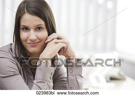 portrait of young businesswoman at desk View Large Photo Image Stock Image - portrait of young businesswoman at desk. Fotosearch