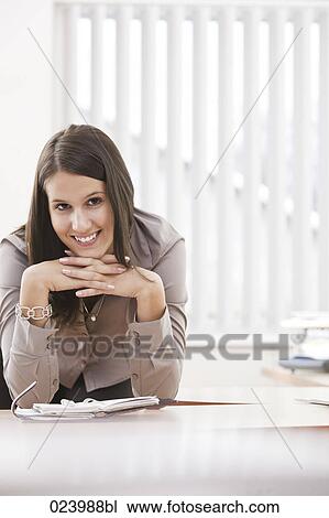 portrait of young businesswoman at desk View Large Photo Image Stock Image - portrait of young businesswoman at desk. Fotosearch