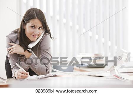 portrait of young businesswoman at desk View Large Photo Image Stock Image - portrait of young businesswoman at desk. Fotosearch