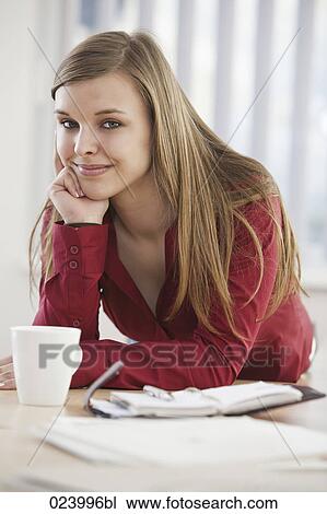 portrait of young businesswoman at desk View Large Photo Image Stock Image - portrait of young businesswoman at desk. Fotosearch