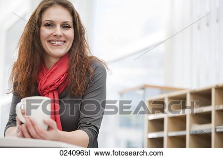 portrait of young businesswoman holding cup View Large Photo Image Stock Image - portrait of young businesswoman holding cup. Fotosearch