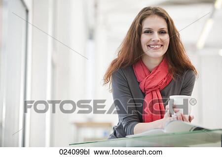 portrait of young businesswoman holding cup View Large Photo Image Stock Image - portrait of young businesswoman holding cup. Fotosearch