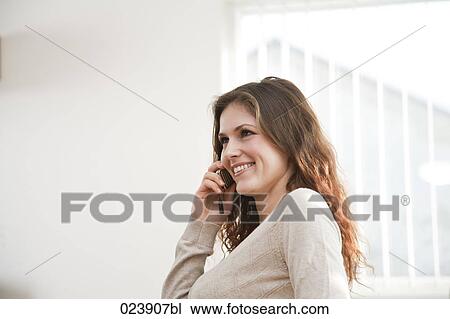 portrait of young businesswoman talking on mobile phone View Large Photo Image Stock Image - portrait of young businesswoman talking on mobile phone. Fotosearch