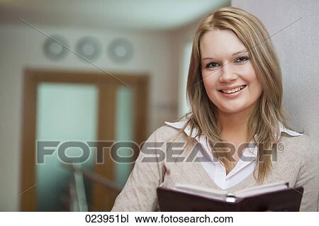 portrait of young businesswoman with file View Large Photo Image Stock Image - portrait of young businesswoman with file. Fotosearch