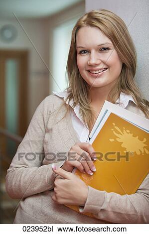 portrait of young businesswoman with file View Large Photo Image Stock Image - portrait of young businesswoman with file. Fotosearch