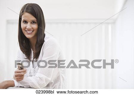 portrait of young businesswoman with mobile phone View Large Photo Image Stock Image - portrait of young businesswoman with mobile phone. Fotosearch