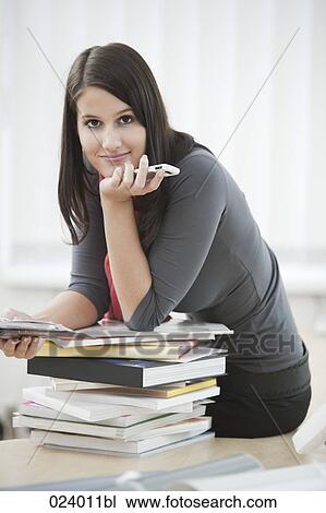 portrait of young businesswoman with diary and mobile phone View Large Photo Image Stock Image - portrait of young businesswoman with diary and mobile phone. Fotosearch