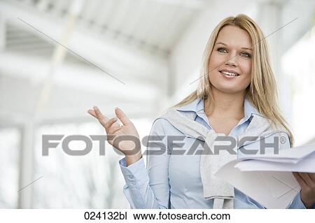 Stock Image - portrait of young businesswoman with document. Fotosearch