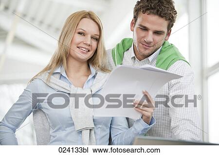portrait of young businesswoman with male colleague View Large Photo Image Stock Image - portrait of young businesswoman with male colleague. Fotosearch