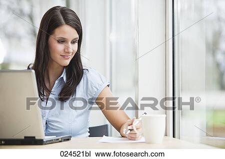portrait of young businesswoman working with laptop computer View Large Photo Image Stock Image - portrait of young businesswoman working with laptop computer. Fotosearch