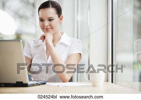 portrait of young businesswoman working with laptop computer View Large Photo Image Stock Image - portrait of young businesswoman working with laptop computer. Fotosearch