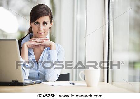 portrait of young businesswoman working with laptop computer View Large Photo Image Stock Image - portrait of young businesswoman working with laptop computer. Fotosearch