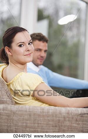 Stock Image - portrait of young couple at home. Fotosearch