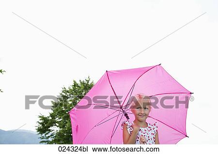 portrait of young girl with pink umbrella View Large Photo Image Stock Image - portrait of young girl with pink umbrella. Fotosearch