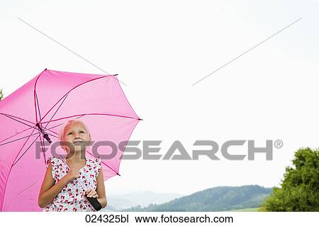 portrait of young girl with pink umbrella View Large Photo Image Stock Image - portrait of young girl with pink umbrella. Fotosearch