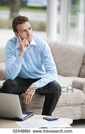 portrait of young man with laptop computer at home View Large Photo Image Stock Image - portrait of young man with laptop computer at home. Fotosearch
