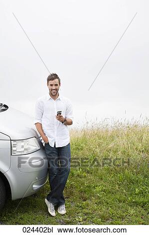 portrait of young man with mobile phone View Large Photo Image Stock Image - portrait of young man with mobile phone. Fotosearch