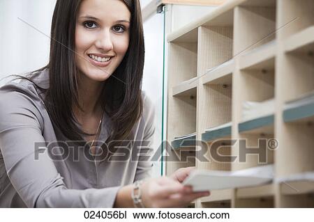 portrait of young office worker distributing documents View Large Photo Image Stock Image - portrait of young office worker distributing documents. Fotosearch