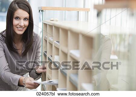 portrait of young office worker distributing documents View Large Photo Image Stock Image - portrait of young office worker distributing documents. Fotosearch