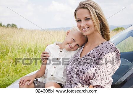portrait of young woman and daughter at car View Large Photo Image Stock Image - portrait of young woman and daughter at car. Fotosearch
