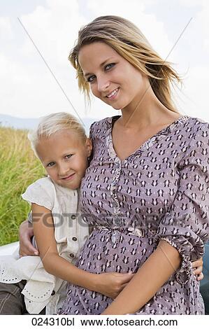 Stock Image - portrait of young woman and daughter. Fotosearch