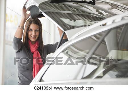 portrait of young woman at car dealer View Large Photo Image Stock Image - portrait of young woman at car dealer. Fotosearch