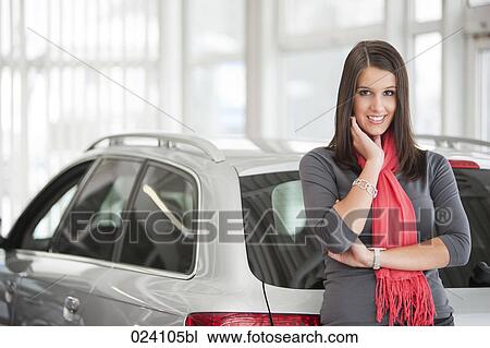 portrait of young woman at car dealer View Large Photo Image Stock Image - portrait of young woman at car dealer. Fotosearch