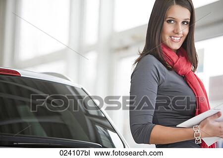 portrait of young woman at car dealer View Large Photo Image Stock Image - portrait of young woman at car dealer. Fotosearch