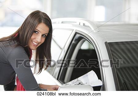 portrait of young woman at car dealer View Large Photo Image Stock Image - portrait of young woman at car dealer. Fotosearch
