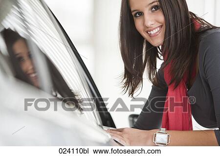 portrait of young woman at car dealer View Large Photo Image Stock Image - portrait of young woman at car dealer. Fotosearch