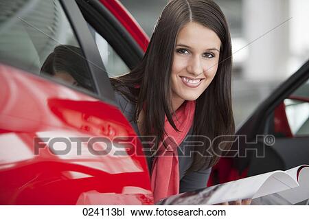 portrait of young woman at car dealer View Large Photo Image Stock Image - portrait of young woman at car dealer. Fotosearch