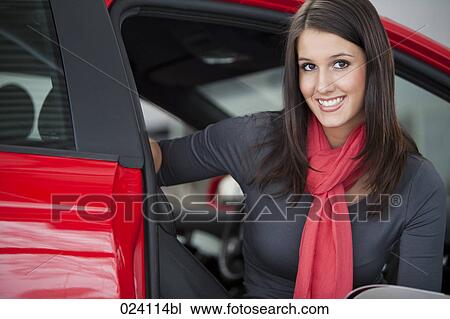 portrait of young woman at car dealer View Large Photo Image Stock Image - portrait of young woman at car dealer. Fotosearch